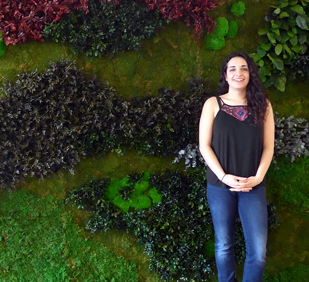 Danielle Pal in front of the Green Wall in the Buttery